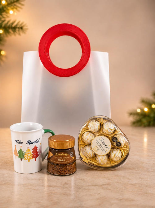 Contenido de la ancheta de lujo: taza Feliz Navidad, café Juan Valdez y chocolates Tresor