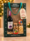 Ancheta navideña con vino tinto, macadamias y frutos secos en caja de regalo Merry Christmas – Salva Flores y Regalos